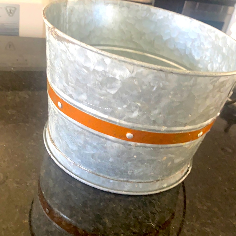 Small round metal bin